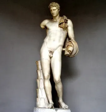 Hermes Belvedere, a white marble nude male statue with short curly hair, a draped cloth over one shoulder, and a missing left forearm.