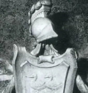 Coat of arms on the Tomb of Ferdinand van den Eynde, with a shield flanked by swan-like figures and topped by a classical helmet crest.