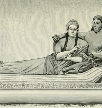 Sarcophagus of the Spouses showing a reclining couple, with a woman gesturing beside a bare-chested man on a decorated couch.