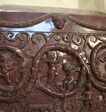 Sarcophagus of Constantina with carved vine scrolls, garlands, and winged figures harvesting grapes.