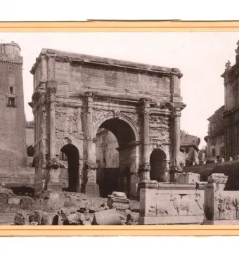 The Plutei of Trajan shown with two marble relief slabs in the foreground, one with cattle and the other with a crowd of figures.