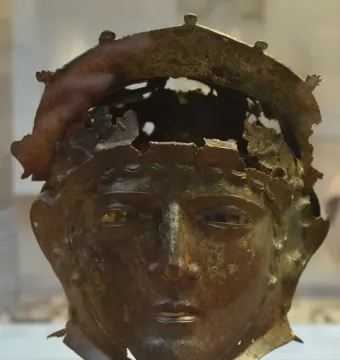Corroded Ribchester Helmet with a sculpted face mask and damaged open crown