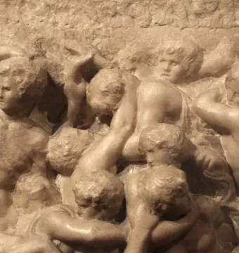 Battle of the Centaurs marble relief with muscular figures in a dynamic struggle