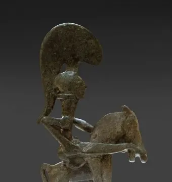 Bronze statuette of the Warrior of Moixent showing a rider on horseback facing right with arms outstretched.