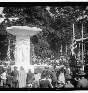 Dupont Circle Fountain with three allegorical sculptures and a crowd gathered for an unveiling ceremony.