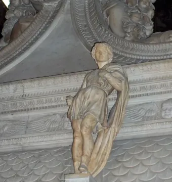 Marble statue of Saint Proculus standing on an ornate base within a larger monument.