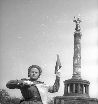Victory Column with a winged figure holding a wreath and staff atop a fluted column.