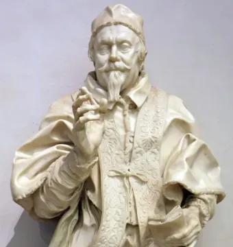 Marble bust of Pope Clement X with a book and raised hand, featuring a scroll inscribed \