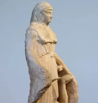Unfinished marble statuette of the Lenormant Athena with rough chisel marks and draped robes.