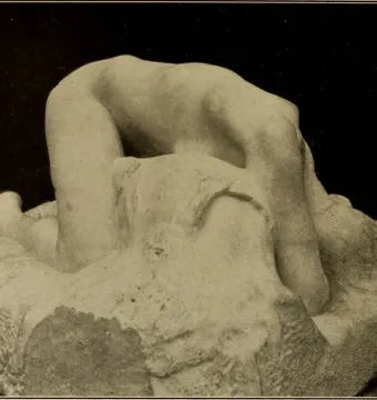 Rodin\'s Danaid shown in a sepia-toned photograph, with a smooth human figure emerging from a rough textured base.