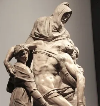 The Deposition marble sculpture showing four figures supporting a limp man.