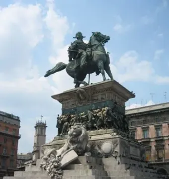 Victor Emmanuel II Monument with an equestrian statue on a marble pedestal and a lion sculpture at the base
