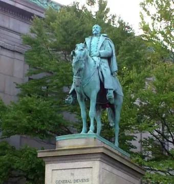 Charles Devens statue, a green-patinaed equestrian monument of a uniformed man on horseback with an inscription on the stone pedestal.