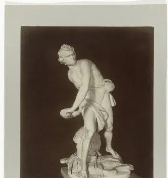 Bernini\'s David marble statue in a dynamic twisting pose, holding a sling and standing on an ornate base.