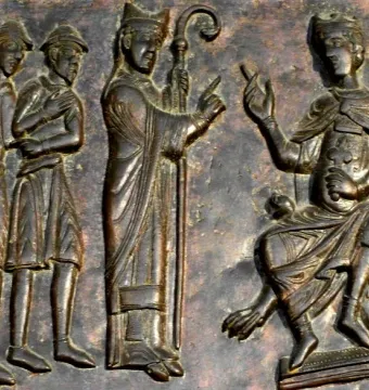Gniezno Doors relief showing a bishop facing a group of men, with a crowned ruler seated at right and an armed guard nearby.