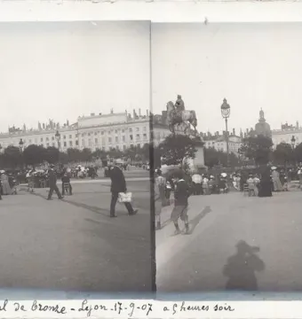 Louis XIV equestrian statue on a pedestal in a busy European city square with crowds and surrounding buildings