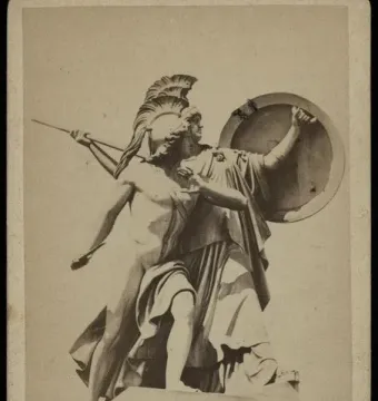 Marble sculpture group of Athena Protects the Young Hero, with a helmeted figure holding a shield behind a young warrior with a spear.