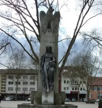 Mutter Kinzig monument with an eagle atop a column and a draped female figure in the fountain base.