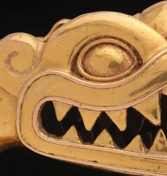 Serpent labret with articulated tongue shown in profile, with a toothed reptile head on a black background.