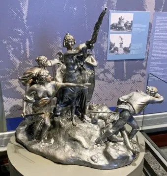 The National Monument of Costa Rica shows a dramatic bronze battle scene with a central female figure raising a broken spear above fallen figures.