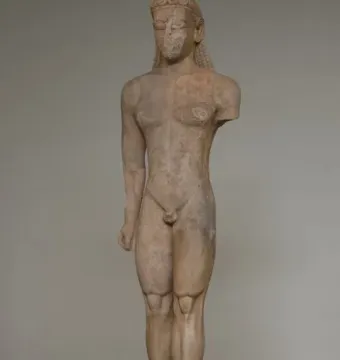 Sounion Kouros marble statue of a nude male youth with long braided hair, shown front-facing with a missing left arm.