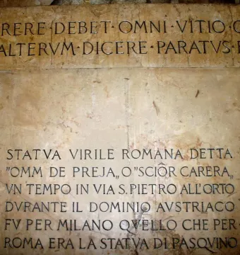 Stone slabs beneath the Scior Carera with Latin and Italian engraved inscriptions.