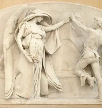 White marble relief sculpture showing a winged female figure reaching toward a sculptor carving a bust.