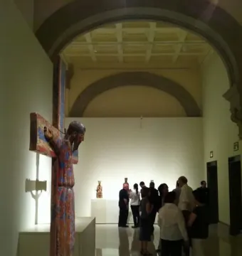 Batlló Majesty, a painted wooden Christ sculpture on a white display base.