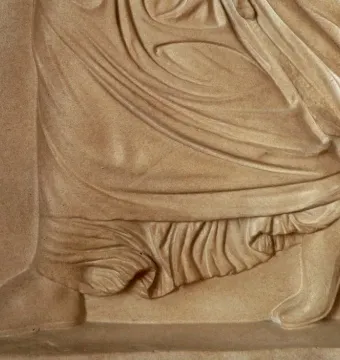 Gradiva relief detail showing the lower body, with one foot planted and the other lifted on its toes.