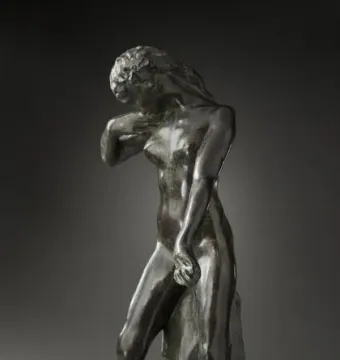 Standing Fauness, a dark bronze female figure with her head bowed and a draped garment at her side.
