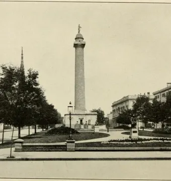 Washington Monument in Baltimore, a tall column topped with a statue in a landscaped city park