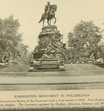 Washington Monument with a large equestrian statue and tiered sculptural figures at the top.