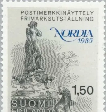 Havis Amanda statue on a Finnish postage stamp with water spouting from marine animals at the base.