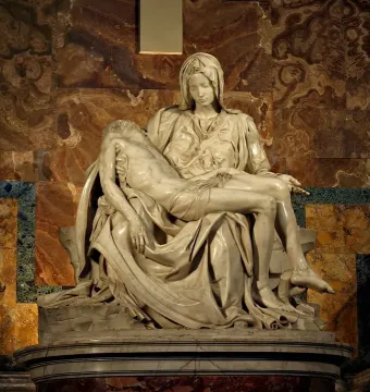 Michelangelo’s Pietà, a white marble sculpture of the Virgin Mary holding the body of Christ.