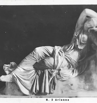 Sleeping Ariadne, a reclining white marble female sculpture with crossed legs and one arm raised over her face.