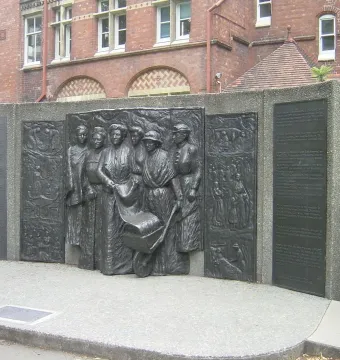 Kate Sheppard National Memorial bronze relief with plaques beside a brick building