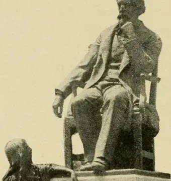 The Dickens and Little Nell monument shows a seated man on a tall pedestal with a smaller figure of a girl standing beside the base.