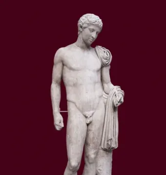 Hermes of Aegium, a light-colored marble statue of a nude male figure with a draped cloth over one shoulder and arm, standing against a dark red background.