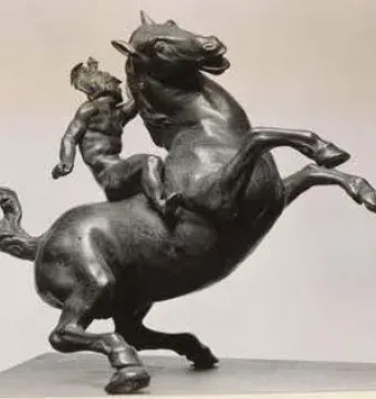 Rearing Horse and Mounted Warrior sculpture showing a bronze horse rearing with a small mounted figure clinging to its neck.