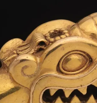 Serpent Labret with Articulated Tongue showing a metallic serpent head with almond-shaped eyes, open mouth, and detailed ridges.