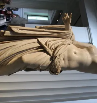 Townley Venus, a white marble statue of a partially draped female figure in a museum gallery.