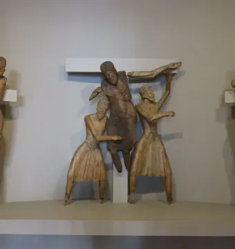 Descent from the Cross wooden sculpture group with carved figures on beams and stands