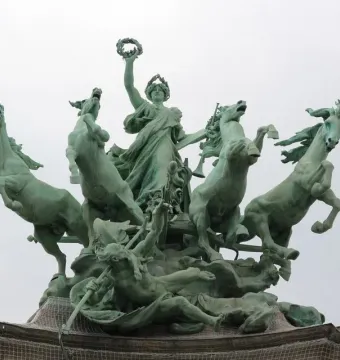 Immortality Overtaking Time sculpture with a female figure raising a wreath above a chariot pulled by four horses