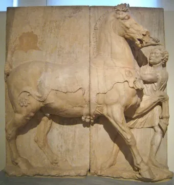 Attic funerary relief showing a horse with a draped blanket and a small attendant holding its bridle.