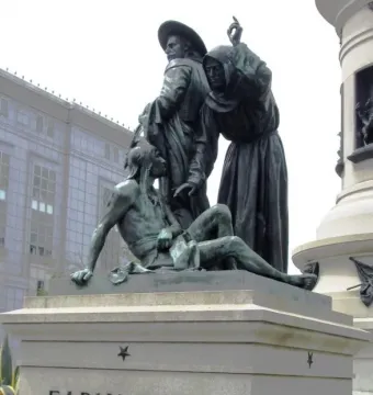 Pioneer Monument bronze sculptural group showing three figures above the carved words \