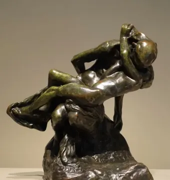 Triumphant Youth bronze sculpture with two intertwined nude figures and a raised, tilted-back pose.