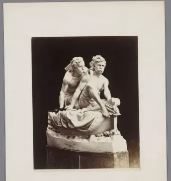 Kanaris at Chios, a marble sculpture of two bare-chested men, one seated with ropes and the other leaning over his shoulder.