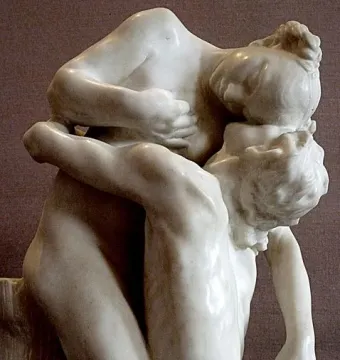 Sakuntala, a white marble sculpture of two nude figures embracing closely with their heads pressed together.