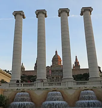 The Four Columns standing before a domed building and fountain