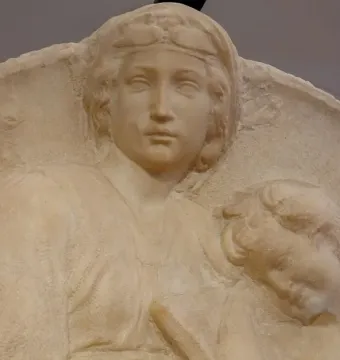 Close-up of Michelangelo’s Pitti Tondo showing a relief of a woman and two children.